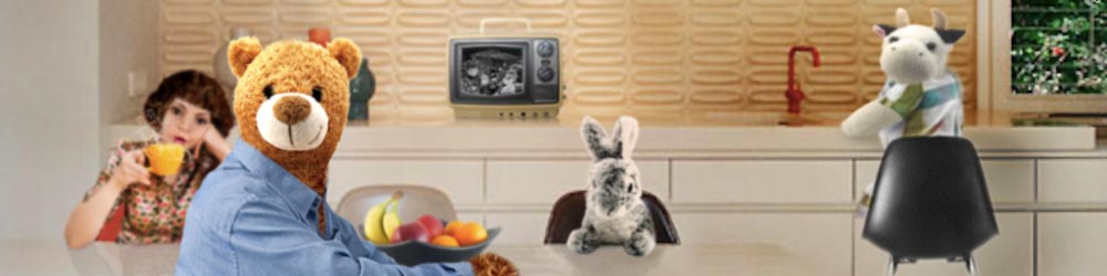 twimii, ted, and rabbit are sat around a table in a retro 1960s kitchen, while cow stands on a chair at the sink, washing dishes