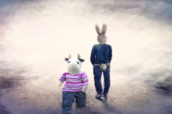 A man-size fluffy rabbit is dressed in jeans and a top, standing with his back facing us, looking out into fog. A small fluffy cow, dressed jeans and a stripey top, is running back towards us. 