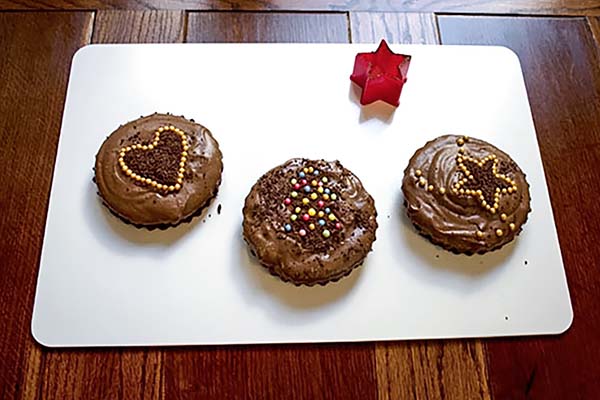 Chocolate Gingerbread Mousse Cakes, decorate with grated chocolate and coloured sugar pearls