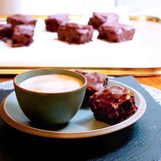 Flourless Caramel Cake Bars with a cup of coffee