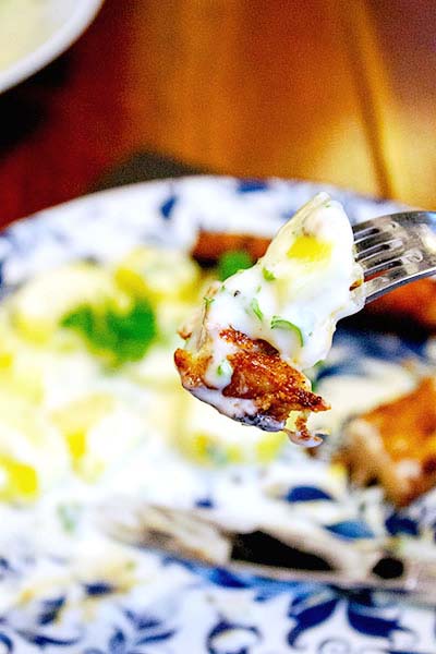 Gluten-free crispy pork with parsley sauce and boiled potatoes