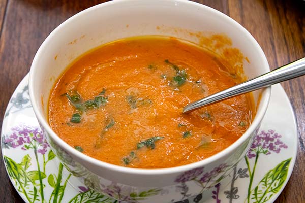 a bowl of yellow-split-pea-soup-with-roasted-tomatoes-red-peppers-garlic