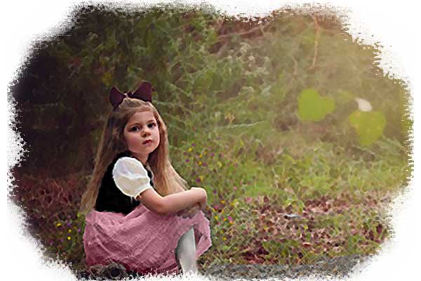 little girl sitting in a meadow, dressed in traditional Austrian clothes