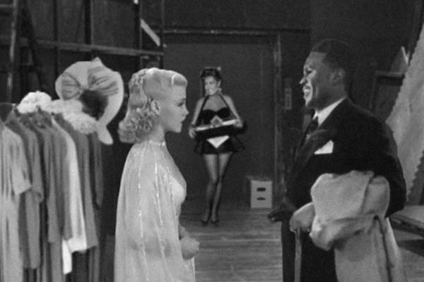 Rosie talking to Mr Lloyd, with Edee in the background.